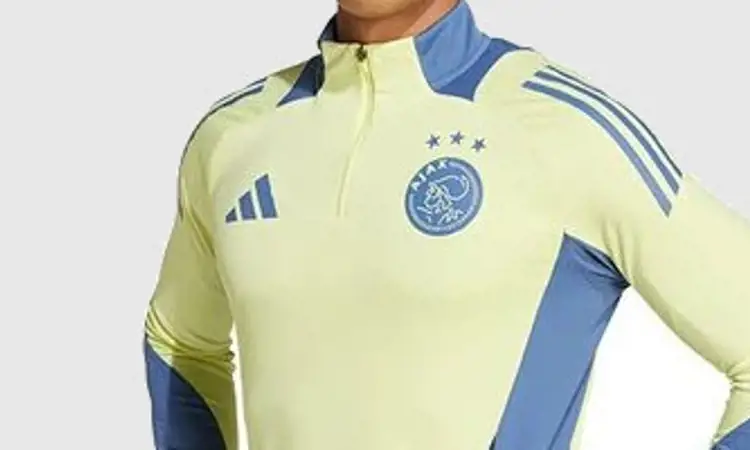 Ajax draagt geel/blauw trainingspak in 2024-2025